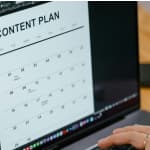 Content creator planning editorial calendar using YouTube video transcripts for blog posts and social media content
