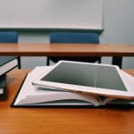 Student using tablet to convert YouTube lecture videos into study notes and educational materials